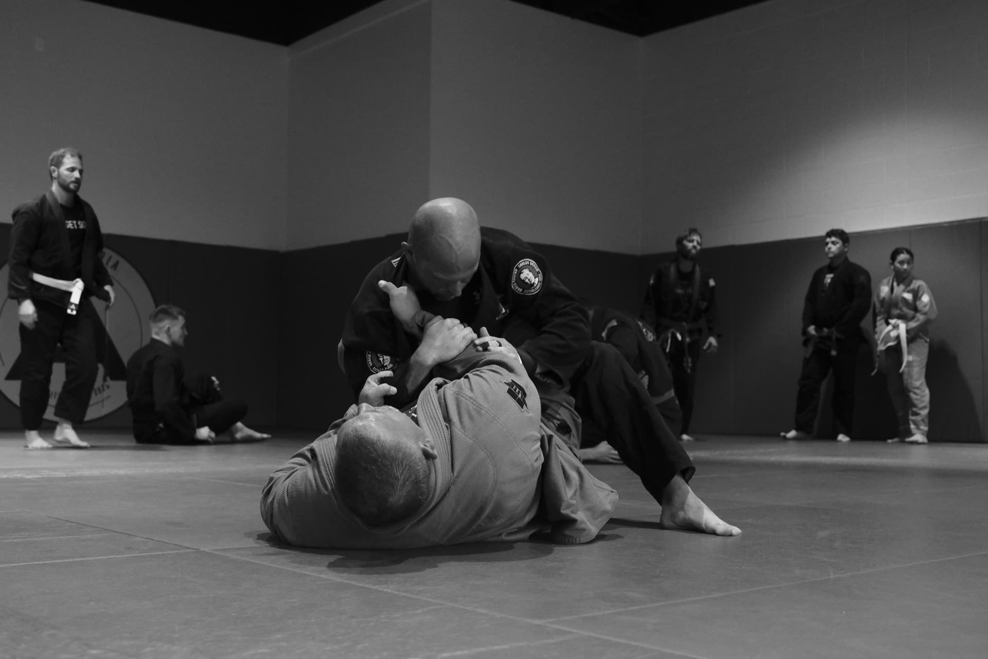 Adult Brazilian Jiu-Jitsu training on the mats